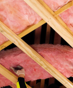 Photo of Pink Batts Ceiling Insulation being installed. Buy cheap Pink Batts online.